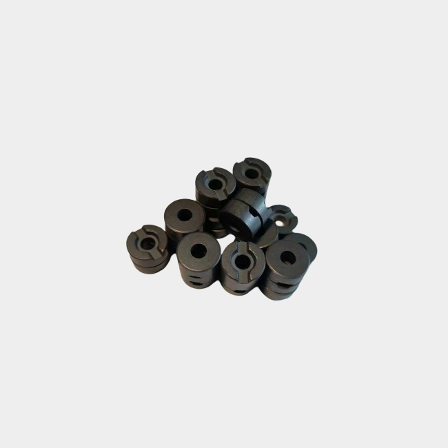 Radially oriented isotropic ferrite magnets with holes and grooves