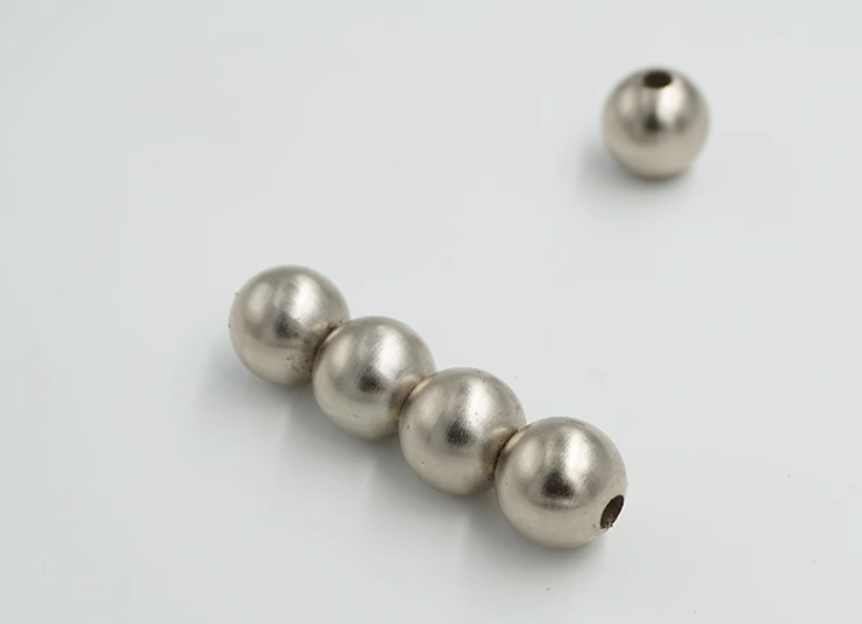 Picture of physical sample of perforated spherical neodymium magnet