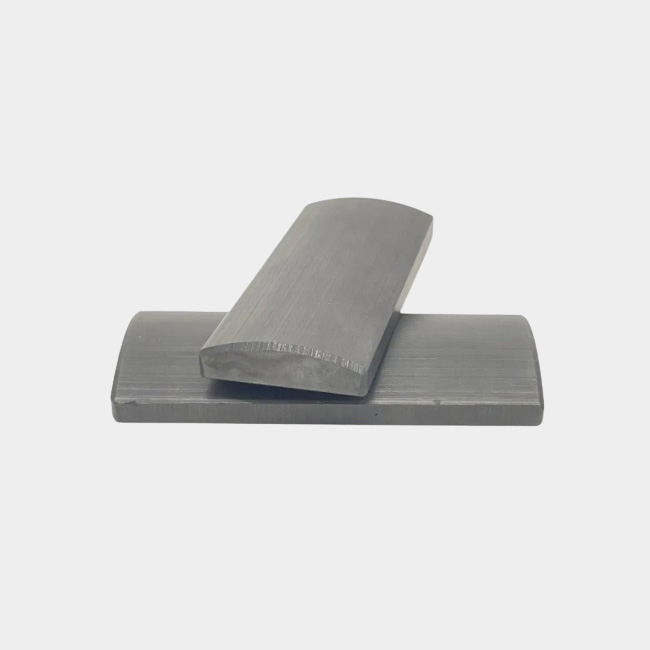  Ferrite block magnet with one curved surface and one flat surface